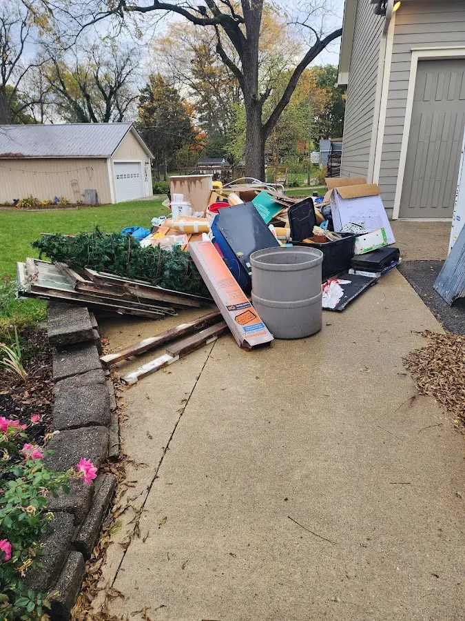 Dumpster being loaded with debris for Residential Dumpster Rental in Crestline